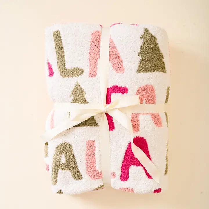 Fa la la blanket folded and tied with a ribbon.