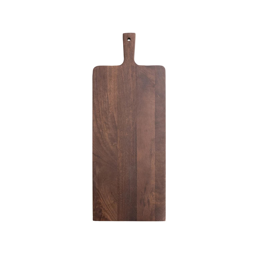 top view of long rectangular Wooden cutting board with handle on a white background