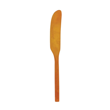 orange marbled resin spreader on a white background