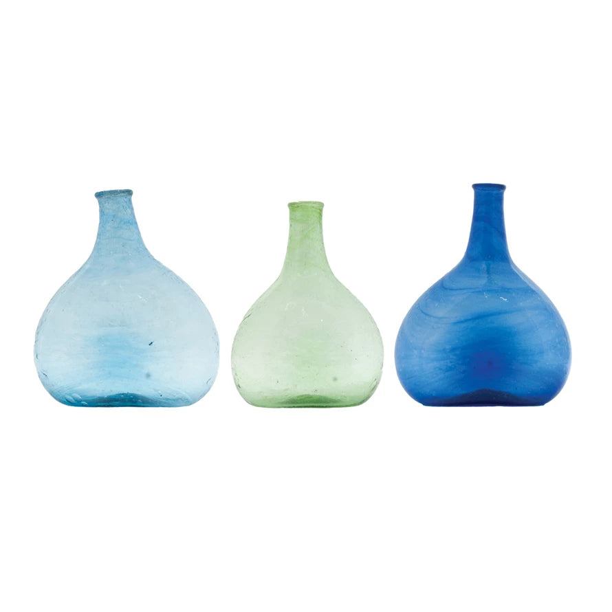 Three colorful vases in light blue, green, and blue on a white background