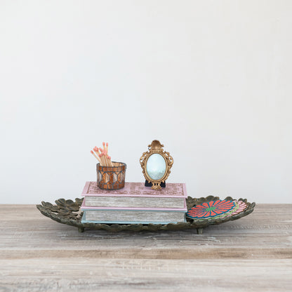 Antique Gold finish flower tray with decor items in it