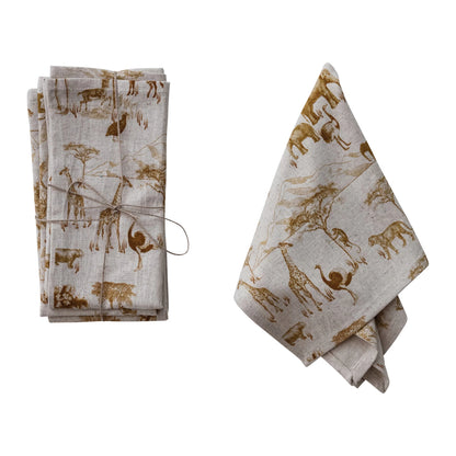 set of Cotton Linen Napkins with Animals Design tied together with twine and another napkin draped next to them
