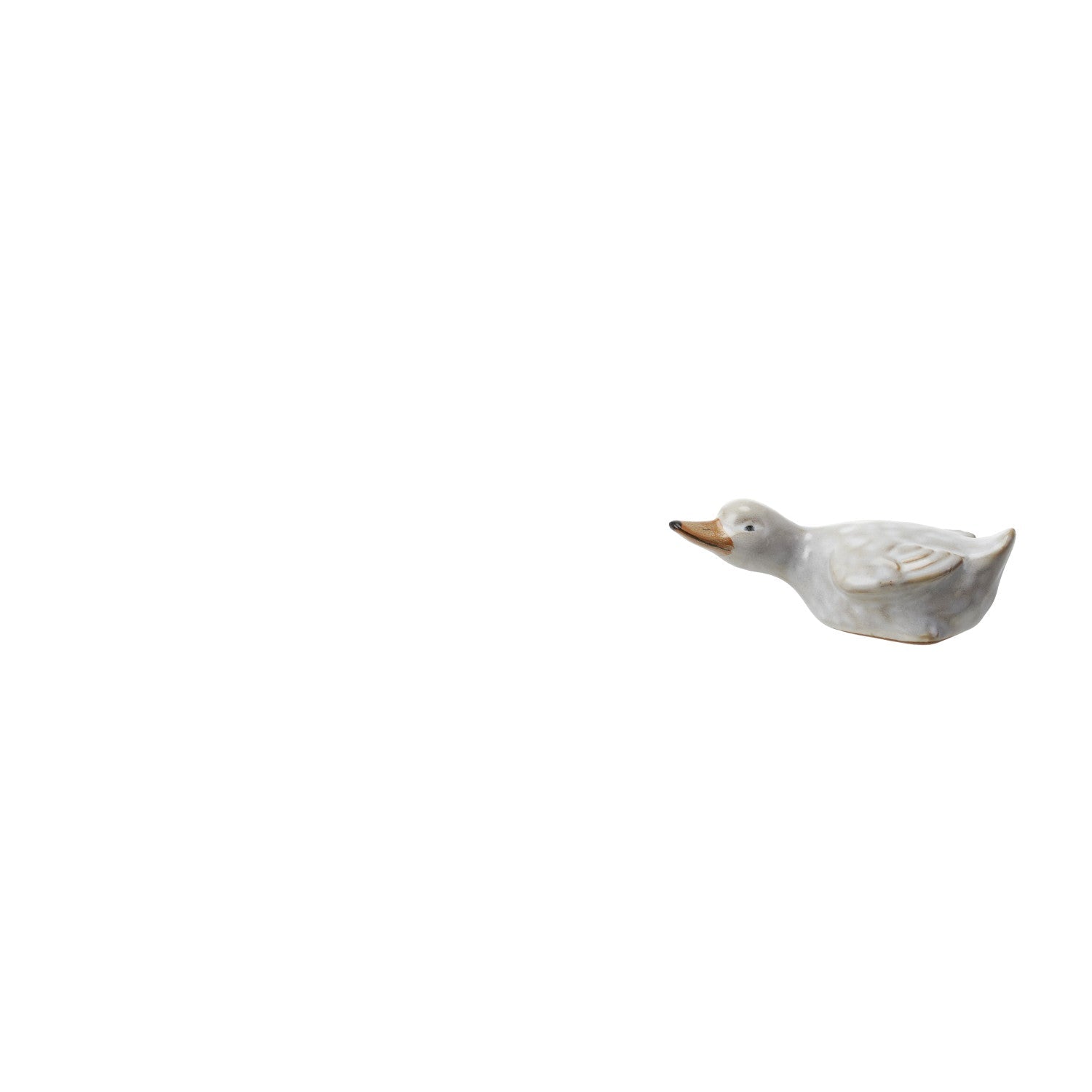stoneware duckling laying flat