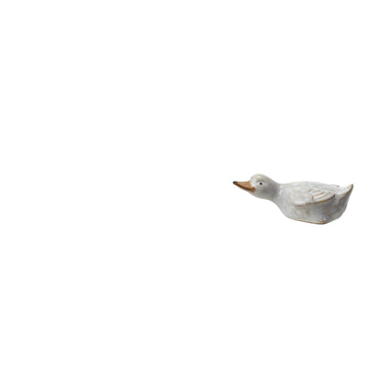 stoneware duckling laying flat