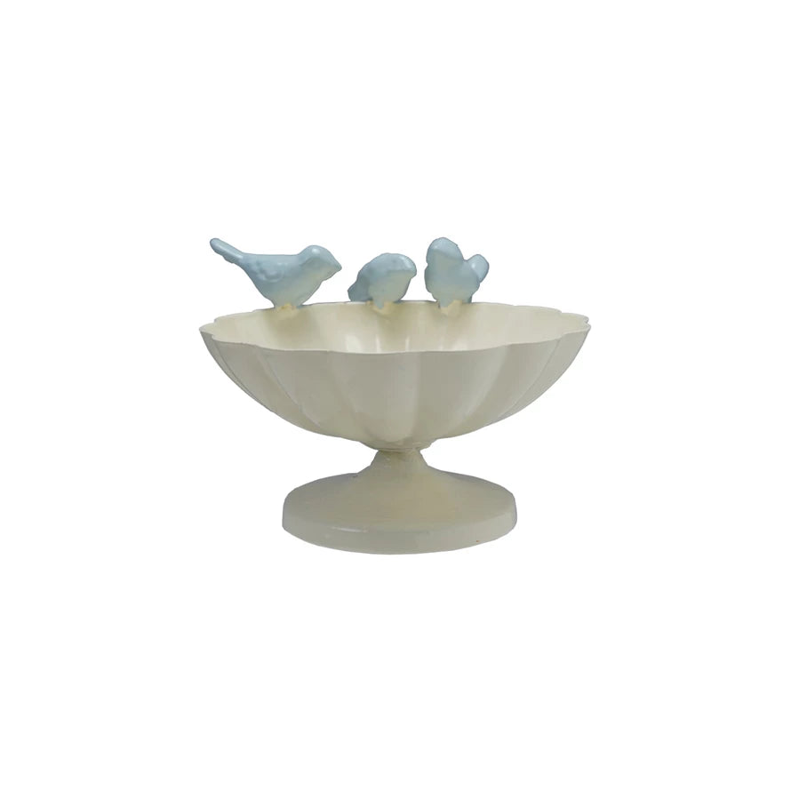Decorative bowl with three small bird figurines on the rim on a white background