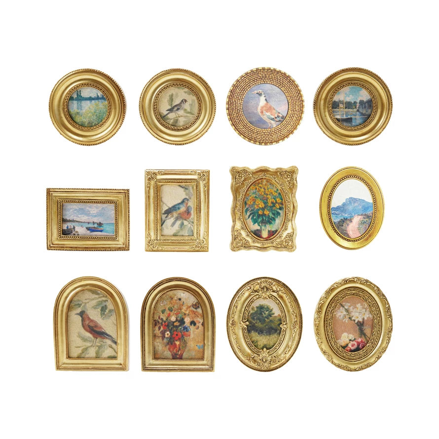 12 gold framed art magnets arranged in rows on a white background
