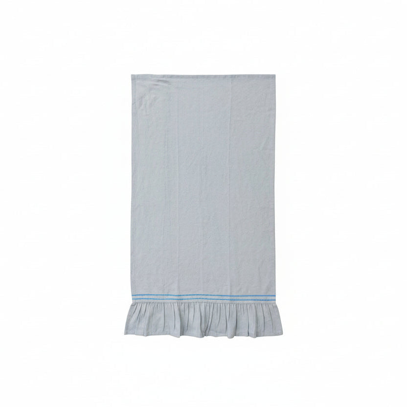 pale blue towel with ruffled hem and a blue stripe on a white background