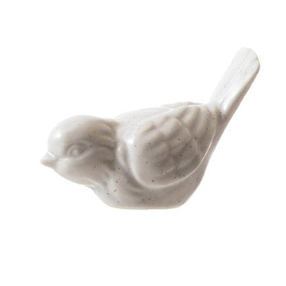 ceramic pale white bird figurine
