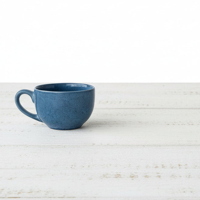 Blue ceramic mug on a white background