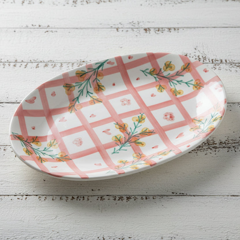 platter with pink plaid and floral design set on a white wooden table