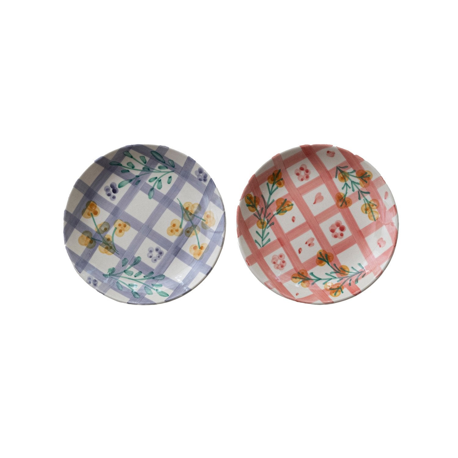 2 plates with plaid and floral design on a white background