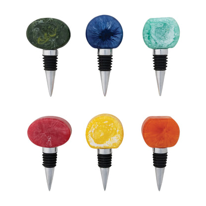 6 different bottle stoppers on a white background