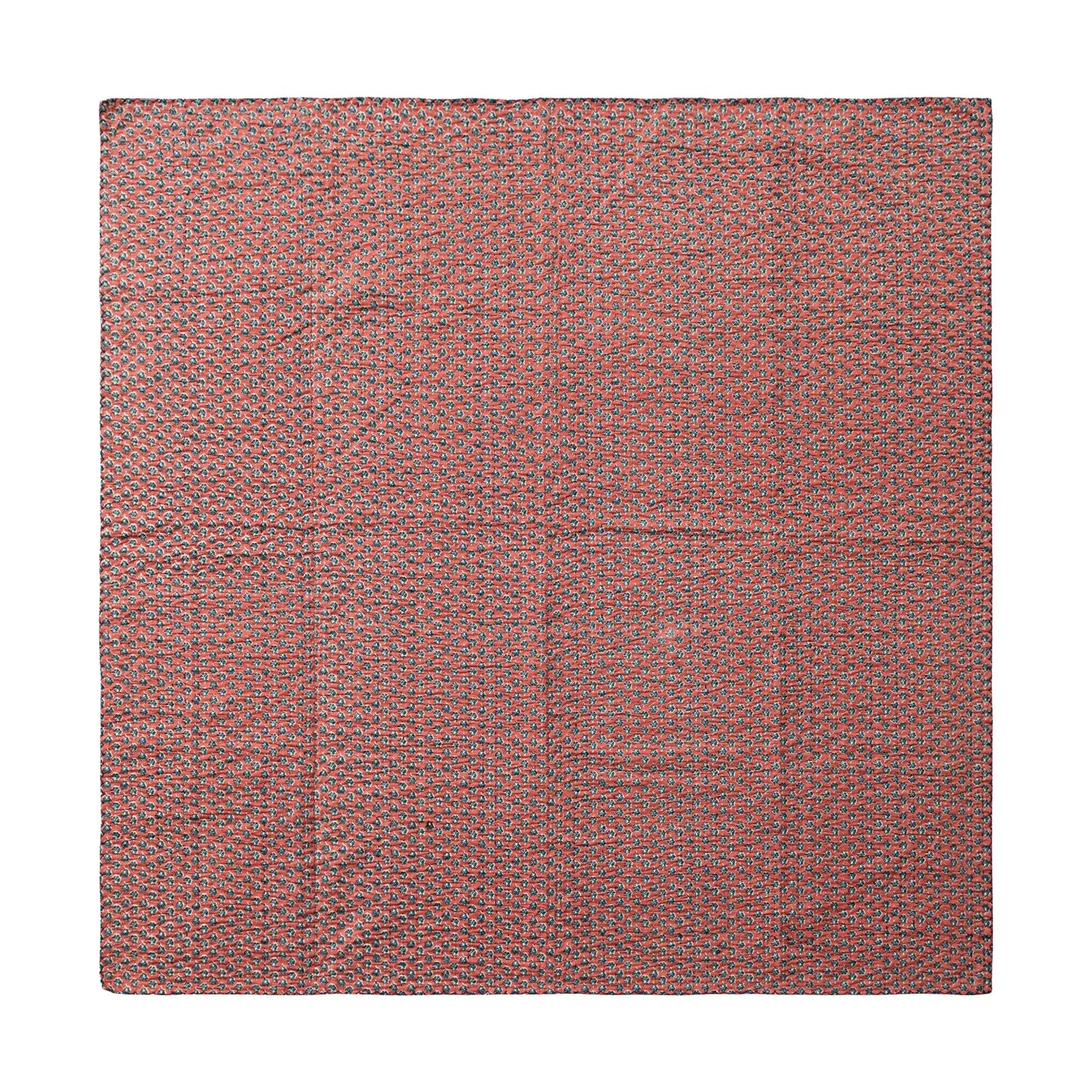red side of the kantha stich blanket laying flat on a white surface