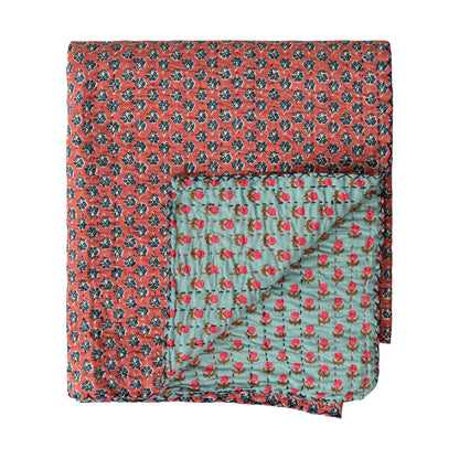 Kantha stich blanket with a corner folded to show reverse side
