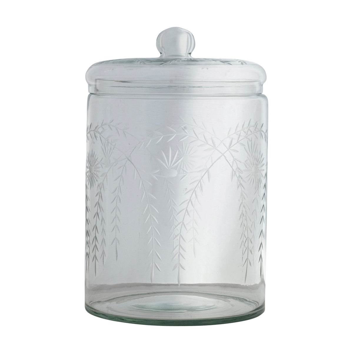 Clear glass jar with leaf pattern and lid on a white background