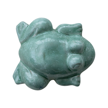 top down view of the teal blue ceramic floating frog figurine