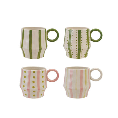 4 assorted pink and green patterned mugs show on a white background
