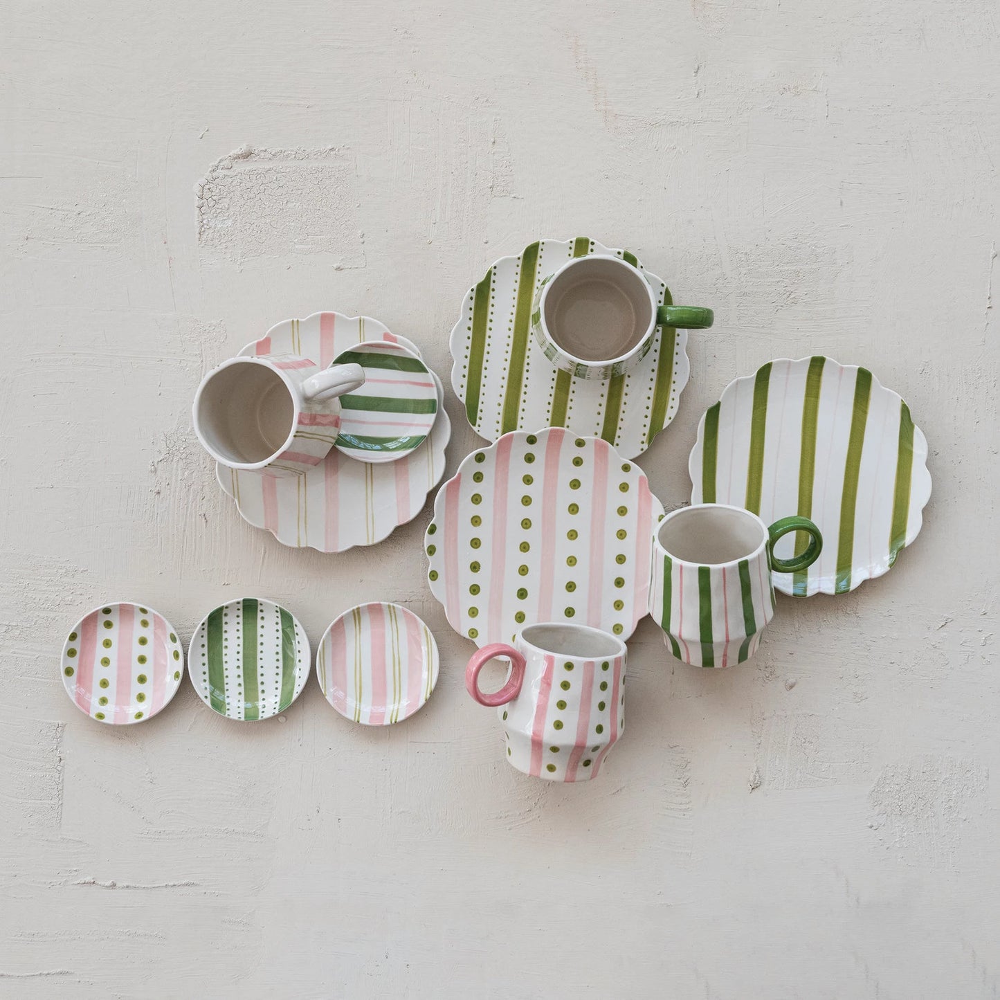  ceramic dishes with striped and polka dot patterns on a light gray background