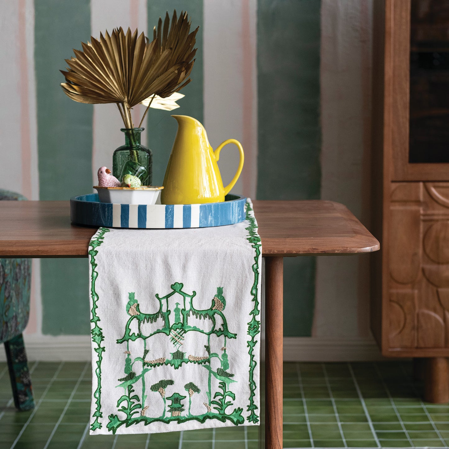 Cream & Green Woven pagoda Embroidered Table Runner on a table with docorative items