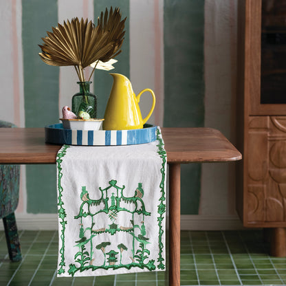Cream & Green Woven pagoda Embroidered Table Runner on a table with docorative items
