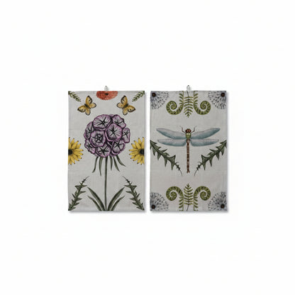 2 towels with botanical designs on a white background