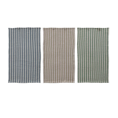 3 towels laying flat on a white background