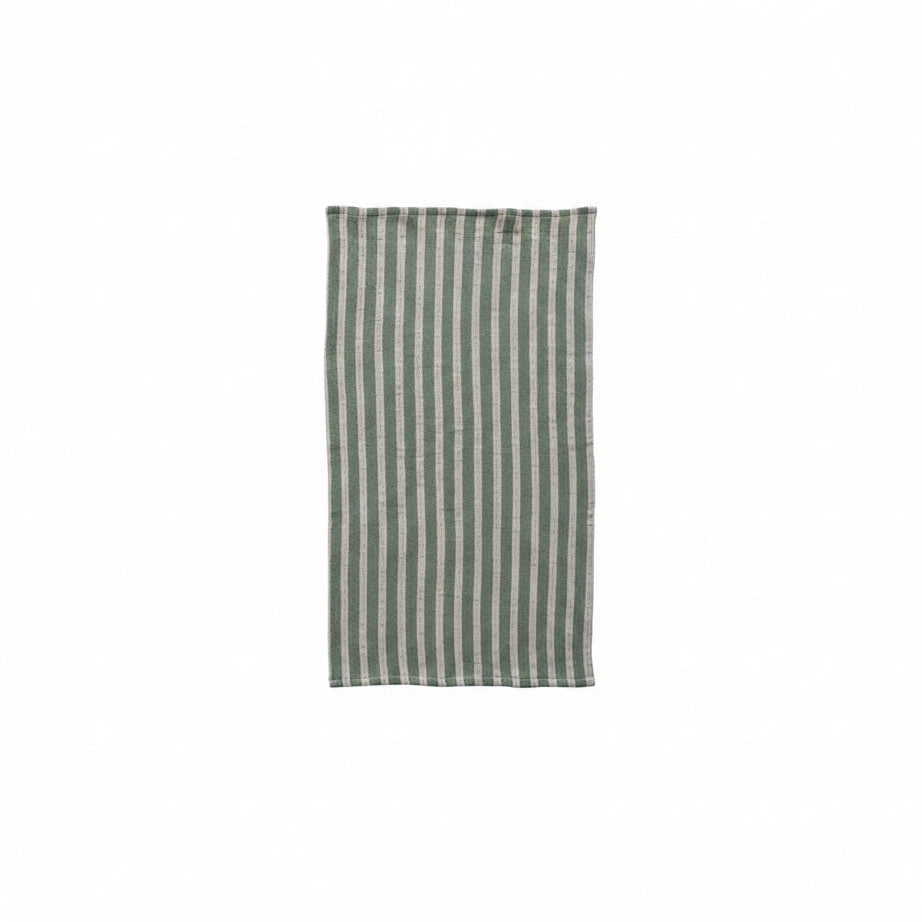 muted green towel with off-white stripes laying flat on a white background