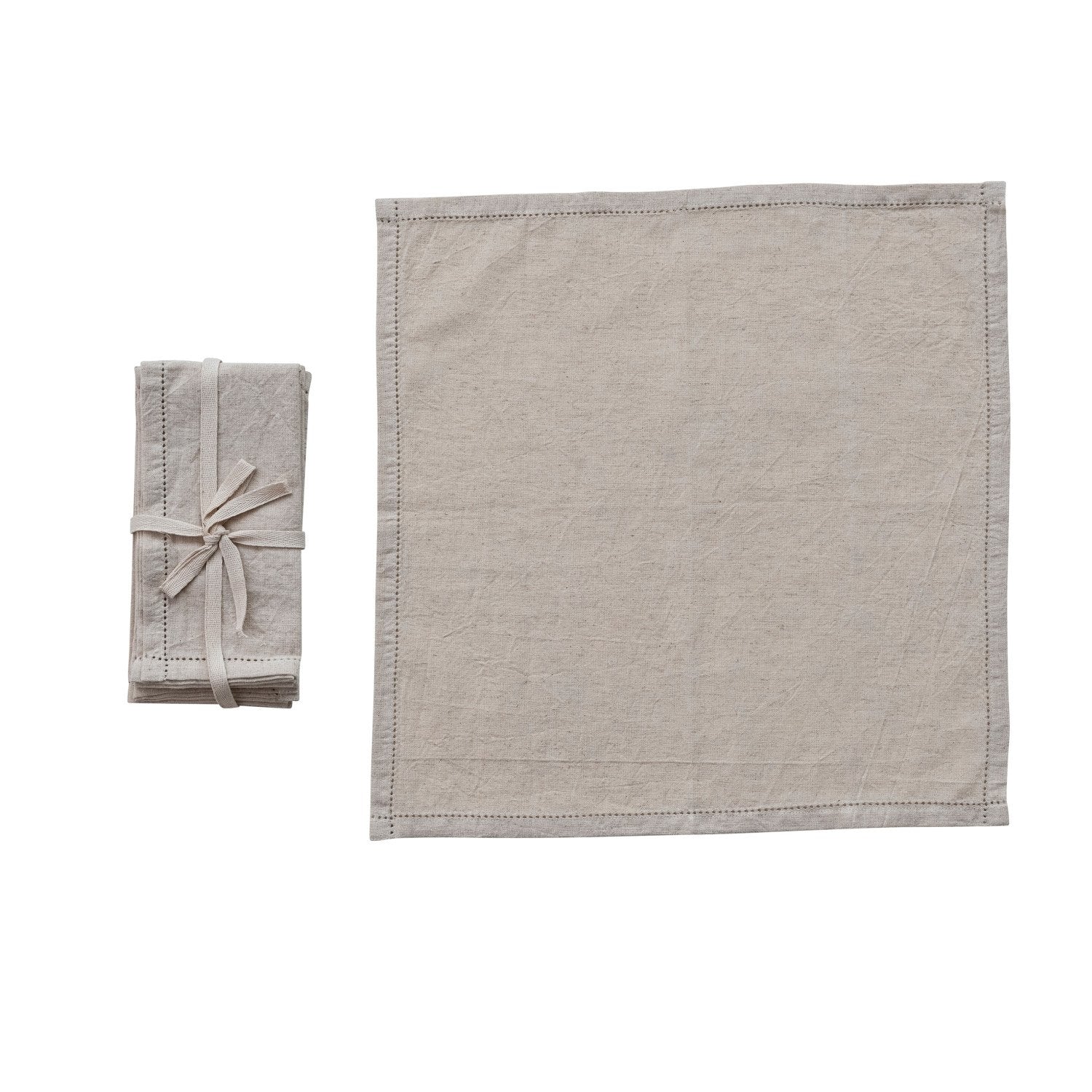 cotton linen napkin laying flat on a white background with a set of them tied together next to it