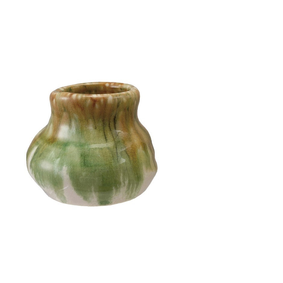 large ceramic vase with green and brown glaze on a white background