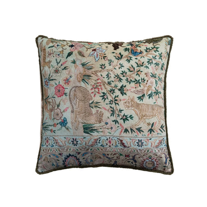 front view of light green pillow with animal and plant design