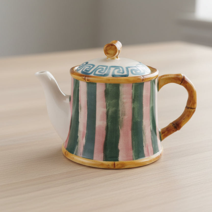 stripe teapot with bamboo accents on a table