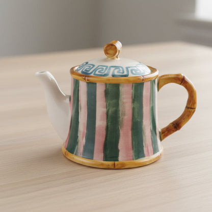 stripe teapot with bamboo accents on a table