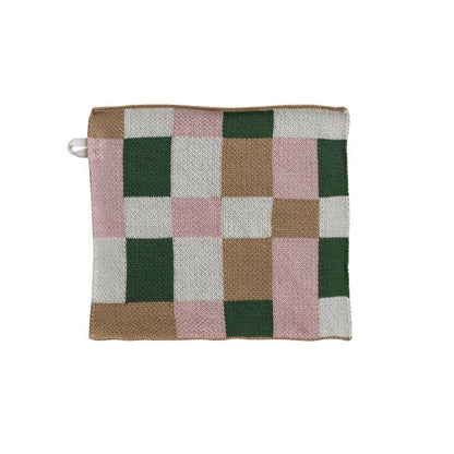 Checkered dishcloth with green, pink, and brown pattern on a white background
