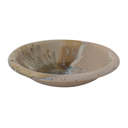 side view of bowl with brown, beige, and blue reactive glaze