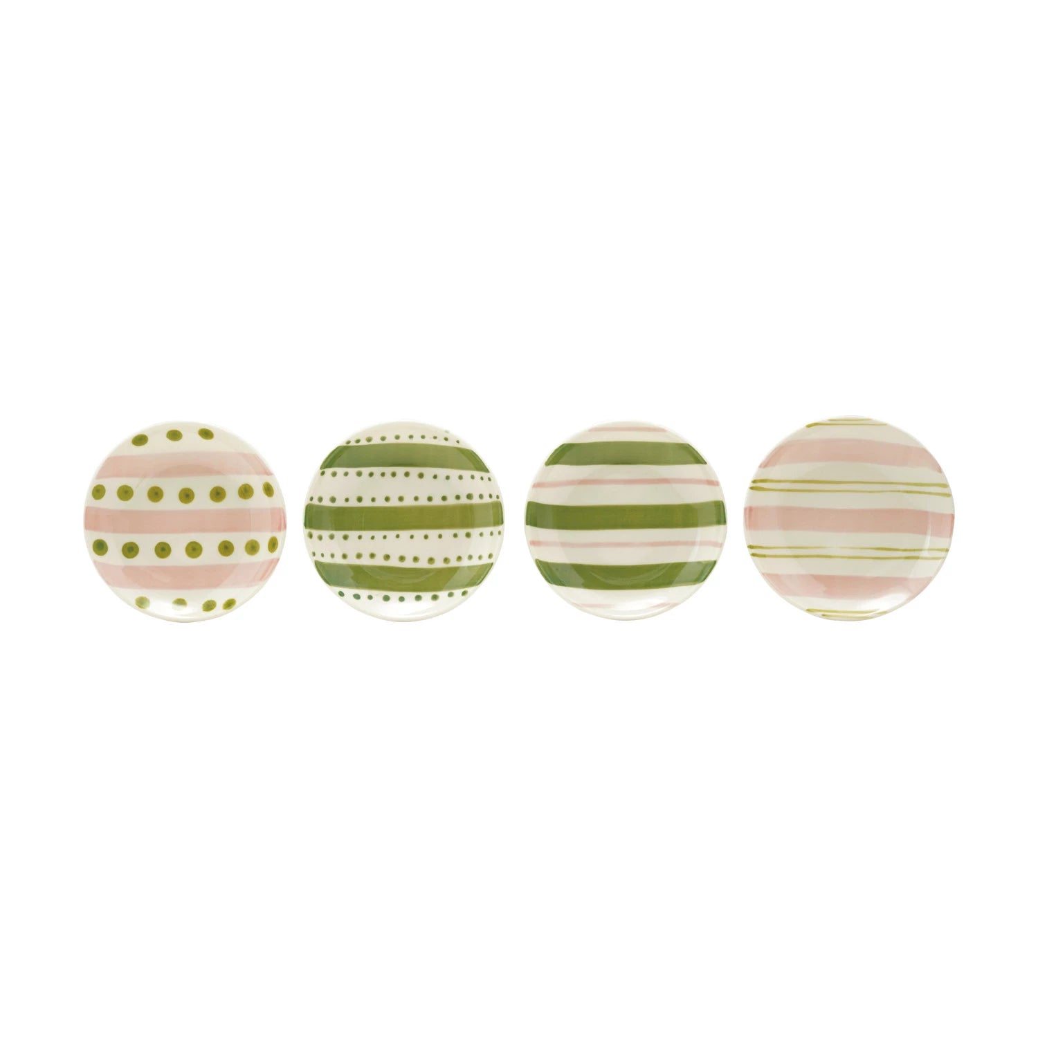 assorted small round plates with pink and green dots and stripes in a row on a white background