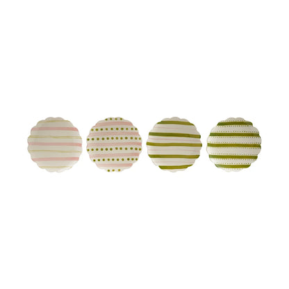 row of ceramic plates with pink and green striped and polka dot patterns shown on a white background