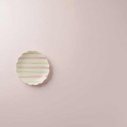 plate with pink and yellow stripes shown on pale pink background