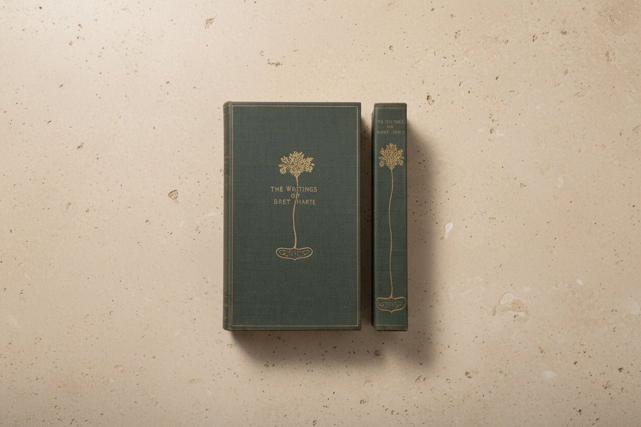 blue vintage style book with gold tree design and titled "the writings of bret marte"