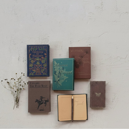 vintage looking books on a plaster background