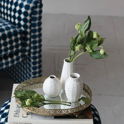 3 sizes of white Basket Weave Vases arranged on a mirrored tray with greenry