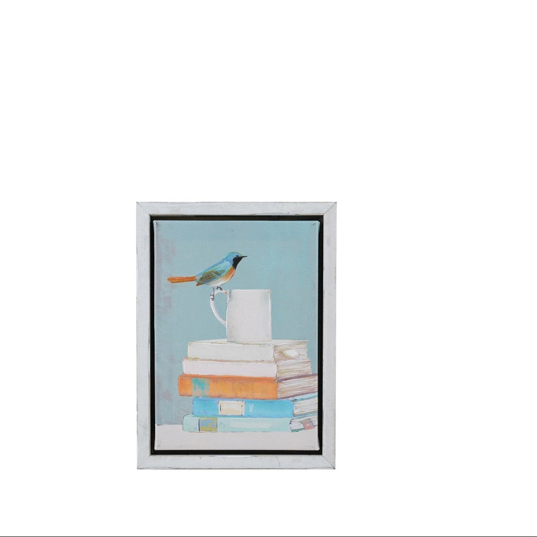 blue framed art print featuring a small blue bird perched on top of a stack of books with a white mug, set against a light blue background.