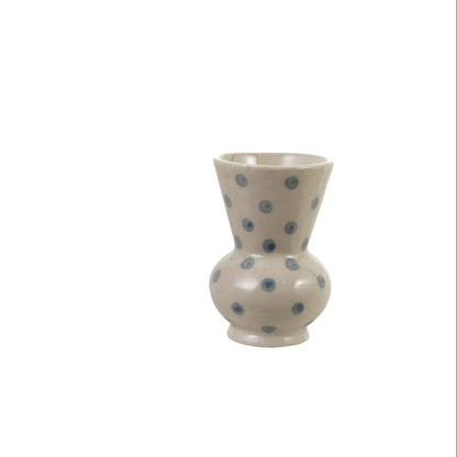 smaller bud off-white bud vase with blue dots, rounded base and wide opening on top