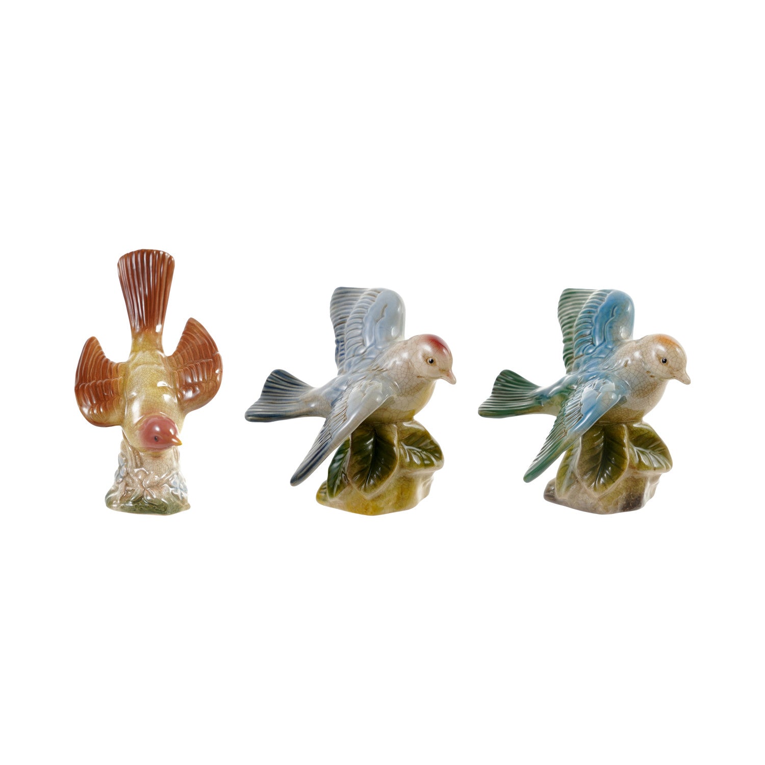 decorative ceramic bird figures  in a row on a white background