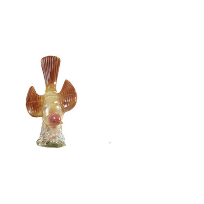 red and yellow decorative ceramic bird figurine