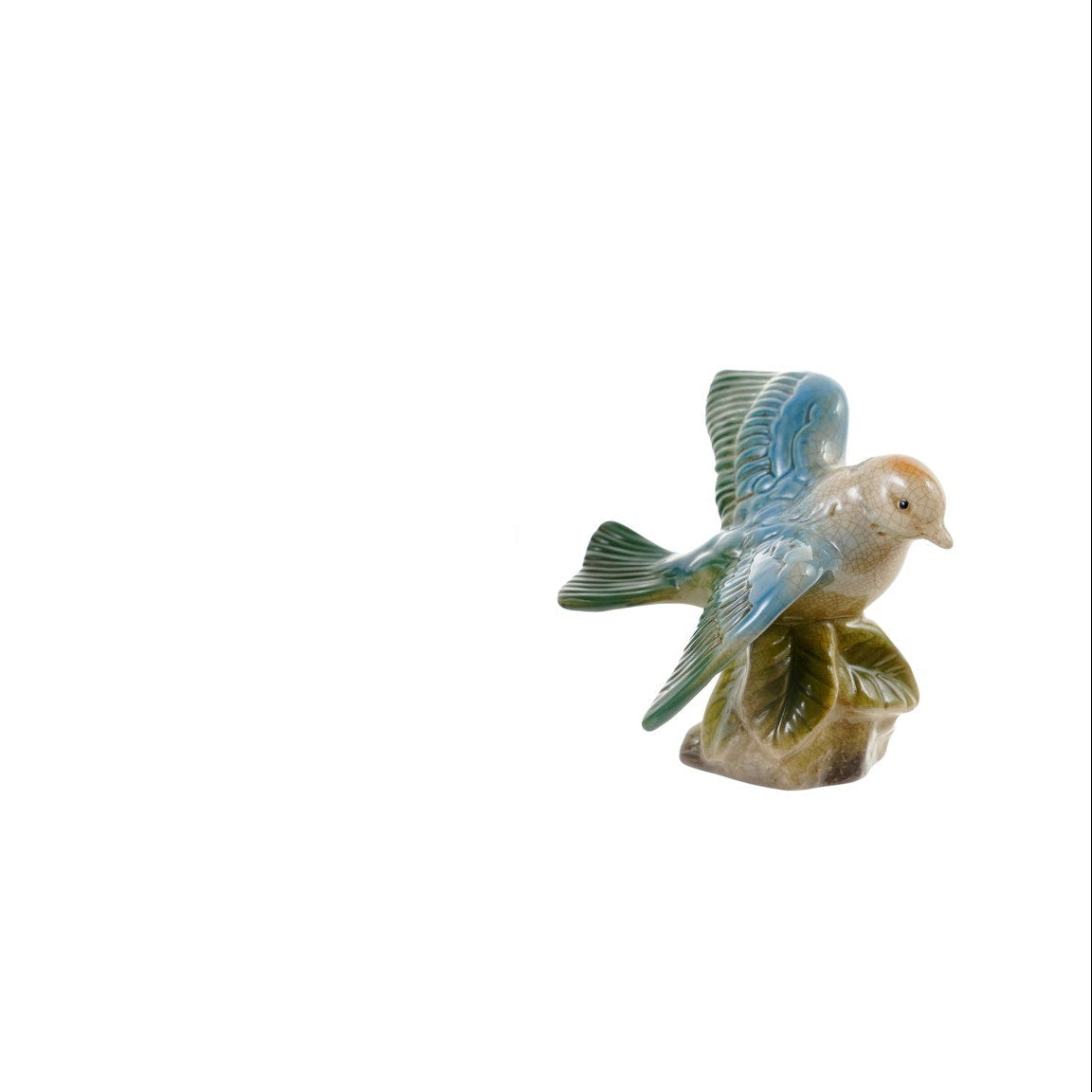 decorative ceramic blue and green bird perched on leaves figurine