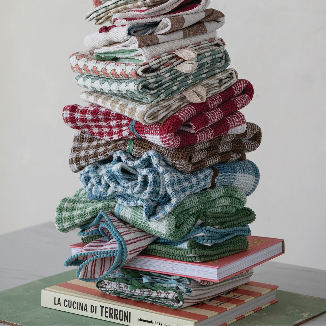 STACK OF ASSORTED FOLDED TOWELS