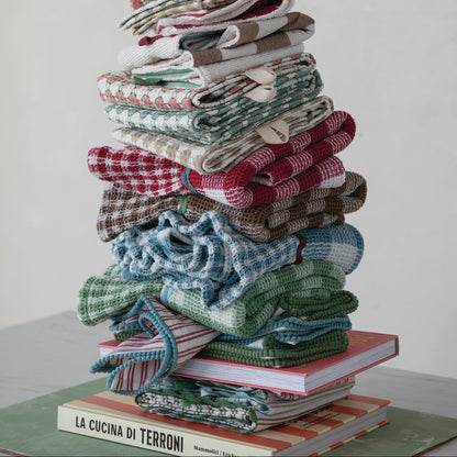 STACK OF ASSORTED FOLDED TOWELS