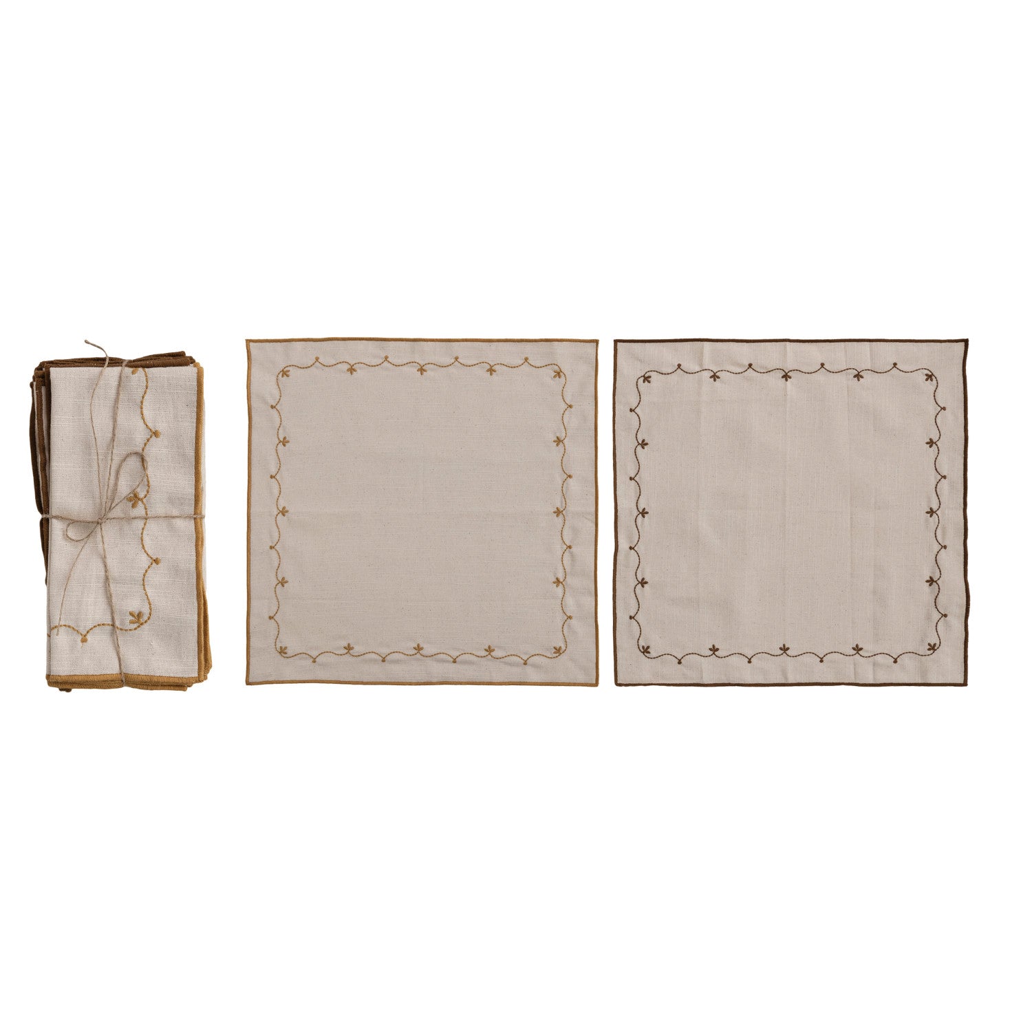 natural cotton napkins with embroidered borders, one folded set and 2 laying flat on a white background