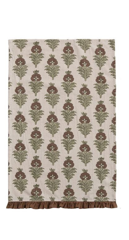 brown block print towel with floral design and brown ruffled hem