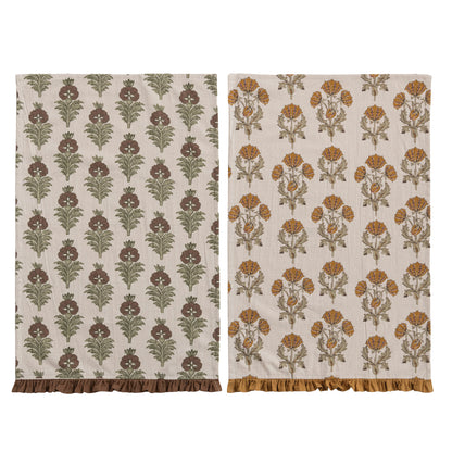 2 assorted floral printed dishtowels laying flat on a white background